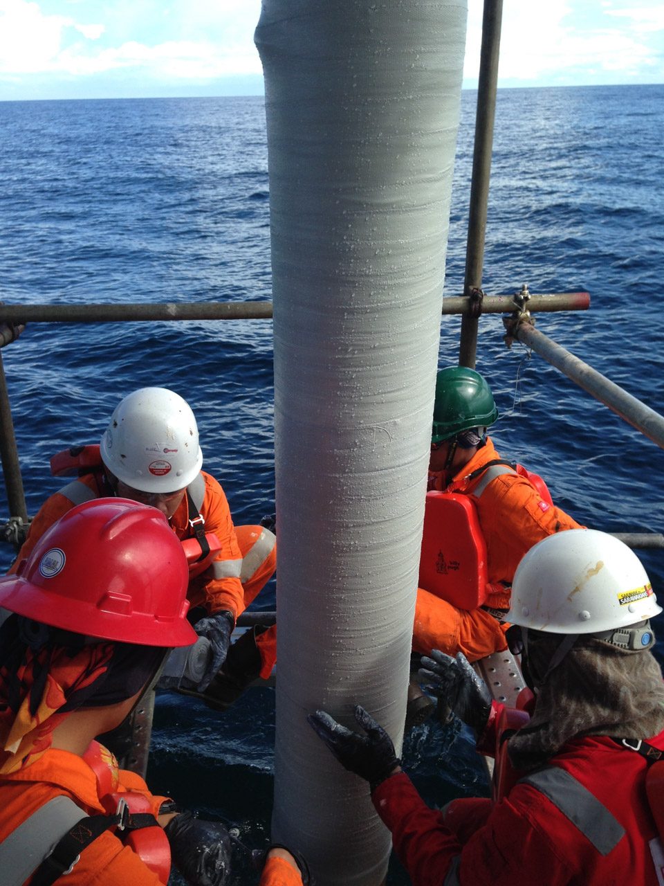 Composite repair sleeve being installed on an offshore riser